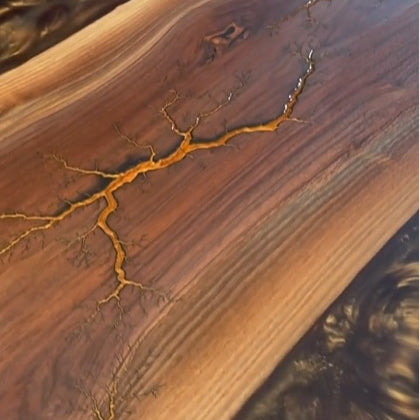 Have you tried using epoxy resin on fractal burnt wood?