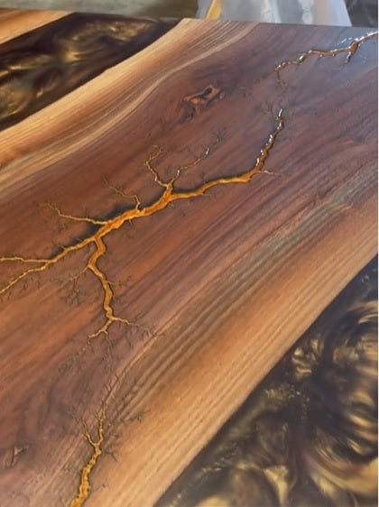 Have you tried using epoxy resin on fractal burnt wood?